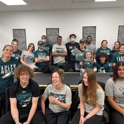 EZ Pizzi cleaning team dressed in Philadelphia Eagles gear